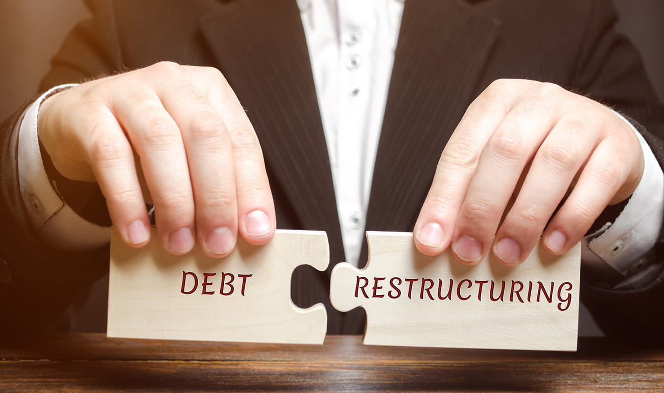 Reorganizing debt so that interest is tax deductible as an alternative to selling assets to cover debts